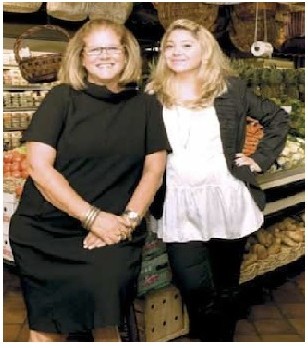Agata Musco and Valentina Musco Puleo standing together in the produce aisle of the market